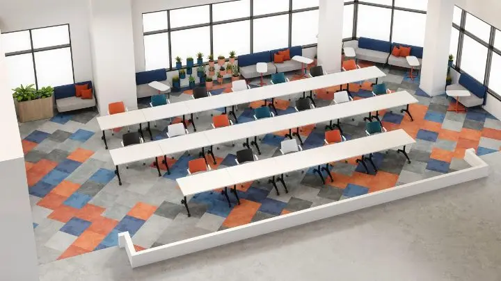 Axonometric view of a training-room layout, with three long rows of white flip-top tables and stacking chairs facing the front, banquette and lounge seating along the window wall and a patterned carpet-tile floor