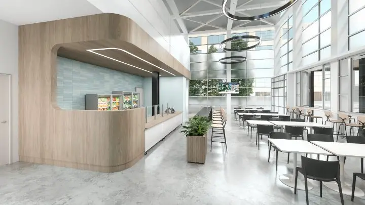 Custom café and servery modeled from the project drawings, with a curved wood soffit over a tiled service counter, cold cases, long communal tables with black chairs and a double-height glazed atrium beyond