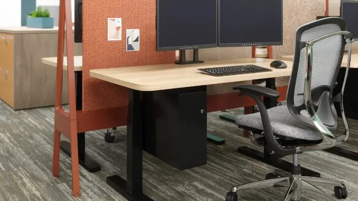 Close-up rendering of a Teknion Expansion Cityline workstation with a height-adjustable desk and Contessa task chair, shown with the beam frame, tackable acoustic screen and a hanging pedestal with integrated power
