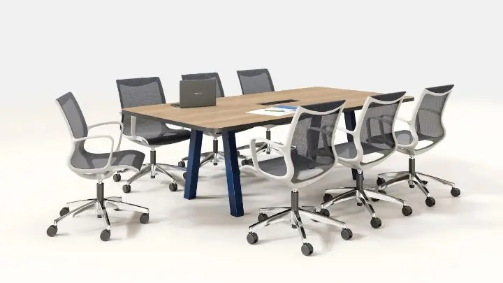 Eight-person conference setting on a white background with a rectangular oak table on angled navy legs and white-frame mesh task chairs on polished aluminium bases
