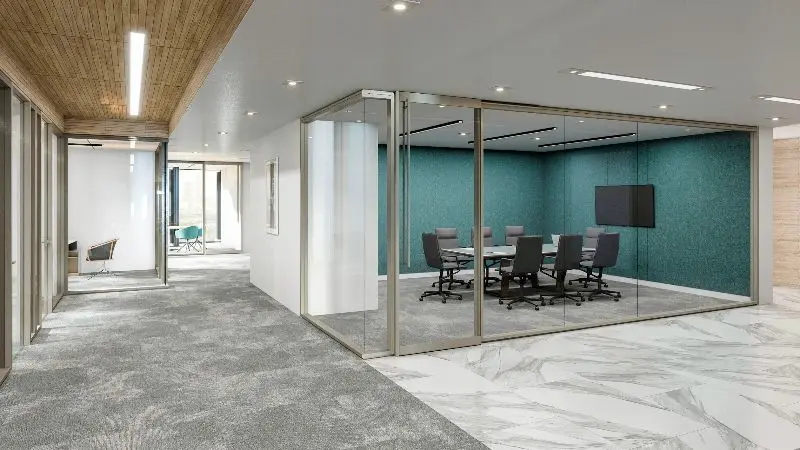 Divider wall system rendering with slim-framed glass fronts on a conference room with a teal acoustic feature wall, mesh chairs and a wall display, off a corridor with marble flooring and a wood slat ceiling